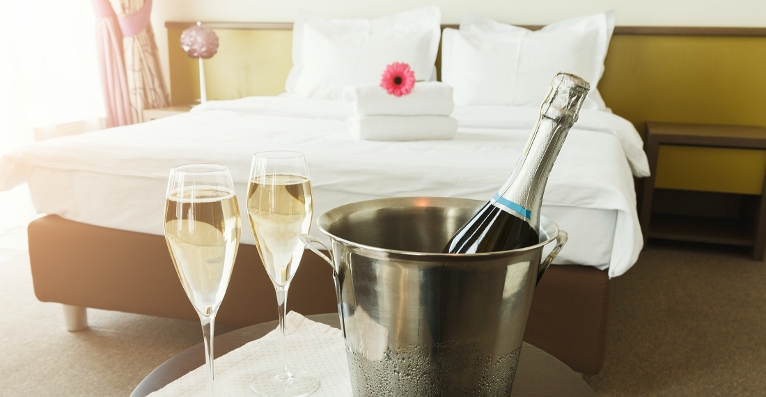 Header two glasses and bottle of champagne in hotel P83 AVSU
