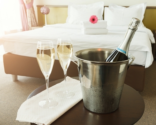 Two glasses and bottle of champagne in hotel P83 AVSU 500